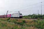 KRE 186 107 hauls an intermodal train through Valburg CUP on 3 June 2020.