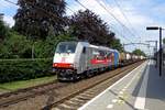 Combinant intermodal shuttle with 186 507 speeds through Tilburg Universiteit toward Antwerp on 18 July 2020.