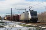 Akiem 186 384 hauls a short mixed freight through Alverna on 16 February 2021.