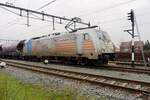 HSL 186 551 has put herself in front of a cereals train at Oss on a grey 14 January 2022.