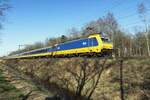 NS 186 032 hauls an IC-Direct through Tilburg Oude Warande on 8 March 2022.