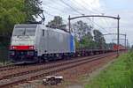 RailPool/Lineas 186 448 hauls a not exactly massively loaded container train through Hulten on 16 August 2019.