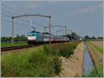 The TRAXX 2802 is heading the IC Amsterdam - Antwerpen near Zevenbergen on September 3rd, 2011.