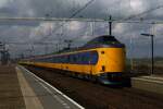 On 26 June 2012 NS 4245 passes through Lage Zwaluwe whilst the skies begin to darken with train clouds.