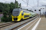 Advertising EMU 9556 speeds through Zwijndrecht on 16 July 2016.
