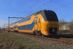 NS VIRM 9409 passes through Alverna on 24 January 2024 as IC to Zwolle and gets photographed from behind the fencing.