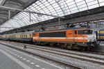 LOCON 9903 stands with an IGE/extra train in Amsterdam Centraal on 16 April 2016.