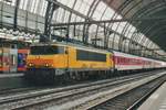 RaiLioN 1613 stands at Amsterdam Centraal with a Munich bound CNL on 25 October 2010.