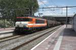 LOCON 9906 hauls a tank train through Rotterdam Centraal on 14 May 2015.