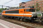LOCON 9906 hauls a tank train through Rotterdam Centraal on 14 May 2015.