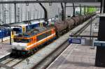 LOCON 9906 hauls a tank train through Rotterdam Centraal on 14 May 2015.