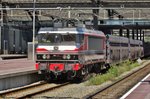 Railogic 1619 hauls a train of empties through Rotterdam Centraal on 20 July 2016.