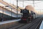 In the last day light on 17 December 2023, VSM 23 071 speeds through Elst with a steam shuttle train to Arnhem.