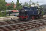 SHM-5 'Enkhuizen' hauls a wtwo axle steamer from the SHM across the area of the SHM on a grey 4 July 2026.