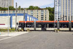 Bergen Light Rail: Tram 219 crossing Fantoftvegen in Bergen.