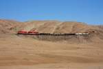 SPCC 32 ( GP40 ) and SPCC 61 ( SD70 ) work hard on their train towards the mines at Toquepala