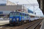 PKP Cargo EU07-1521 hauls a TLK train out of POznan Glowny on 4 May 2024.