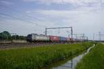 On 29 May 2026 PKP Cargo International EU46-513 hauls a trailer train through Valburg.