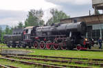 Polish ex-DRG Kriegslok Ty 42-107 stands as a guest in Vrutky Nakladi Stanica on 30 May 2015.