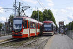 Duewag N8C-NF (1171) passing PESA 128NG (1053) at the halt in front of the Gdansk University. Date: August 14 2019.