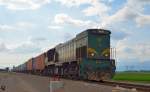 Diesel loc 664-120 is hauling container train through Cirkovce on the way to Hodo. /8.5.2013