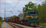 Diesel loc 664-107 pull freight train through Maribor-Tabor on the way to Tezno yard.