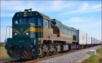 Diesel loc 664-108 pull container train near Podvinci on the way to Pragersko.