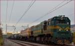 Diesel loc 664-108 pull freight train through Maribor-Tabor on the way to the north.