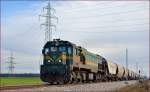 Diesel loc 664-109 is hauling freight train through Polje on the way to Pragersko. /14.2.2014