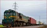 Diesel loc 664-104 is hauling container train through Cirkovce on the way to Koper port. /14.2.2014
