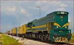 Diesel loc 664-103 pull container train through Cirkovce-Polje on the way to Hodoš. /3.6.2014