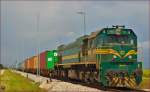 Diesel loc 664-112 pull container train through Cirkovce-Polje on the way to Hodoš.