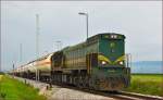 Diesel loc 664-106 pull freight train through Cirkovce-Polje on the way to Hodoš.