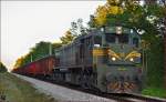 Diesel loc 664-106 pull freight train through Kidričevo on the way to Koper port.