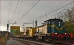 Diesel loc 643-042 pull freight train through Maribor-Tabor on the way to Studenci station. /17.11.2014