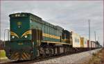 Diesel loc 664-110 pull container train through Cirkovce-Polje on the way Koper port.