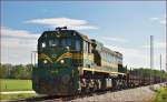 Diesel loc 664-113 pull freight train through Cirkovce-Polje on the way to Koper port. /27.4.2015