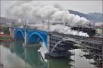 Steam loc 06-018 pull passenger train over Drava Bridge on the way to Pragersko.