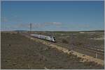 The SNCF OUiGO TGV Rame 813 on the way from Madrid to Barcelona by Bujaraloz (Spain) on the high speed line.