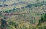 A Class M5 loco is pulling a rake of passenger wagons in the Nawalapitiya incline which is in 1:44 gradient  seen in 2002 Oct.