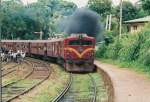 Original Class M5 Hitachi locomotives became  unsuccessful and subsequently some of them rehabilitated with Paxmon & Caterpillar engines.The one in the picture is a CLASS M5 -779 fitted with a 1600 hp Caterpillar 3516 DITA engine seen at Peradeniya in 2010. Driver had to slow down due to workers on the track and had to throttle as he was short of the platform. Black smoke is a clear indication that he had given too much power.