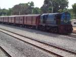   Class M8 - 843  with a rake of empty wagons is parked on a siding at Kilinotchchi on 26th Oct 2013.