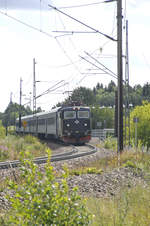 SJ Rc6 1341 on the line from Borlänge to Leksand in Dalarna, Sweden. The black locomotive is well-known as engine on the nicht and regional trains in Sweden. Date: 1. August 2017.