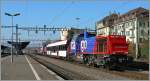 Am 843 072-0 and 061-3 with an  Inova  passenger wagon in Renens VD.
09.11.2011