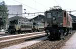Ae 3/6 II no 10439; Ae 4/7 no 11006 and annother at Olten, August 15th, 1980; Showing the engines of the depot Olten by an expert to a group of railway enthusiast.
