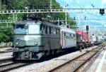 I hope it works: stark modified scanned picture of 11408 hauling a freight through Arth-Goldau on 18 July 2001.