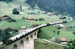 Ae 8/8 and in the train Ae 6/8 with a cement train at Kanderviaduct, July 28th, 1980.