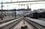 Re 4/4 I under the bridge with form signals at St.Gallen, May 16th, 1982.
