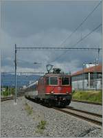 SBB Re 4/4 II 11303 with an IR to Brig by Prilly-Malley.