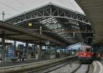 Unter the beautiful Station-Hall of the Lausanne waits a SBB Re 4/4 II to the departure.